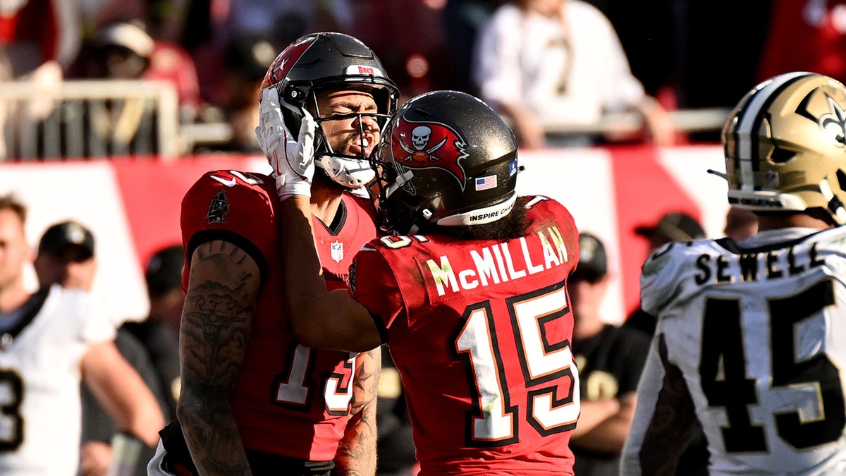 Mike Evans and Jalen McMillan celebrate