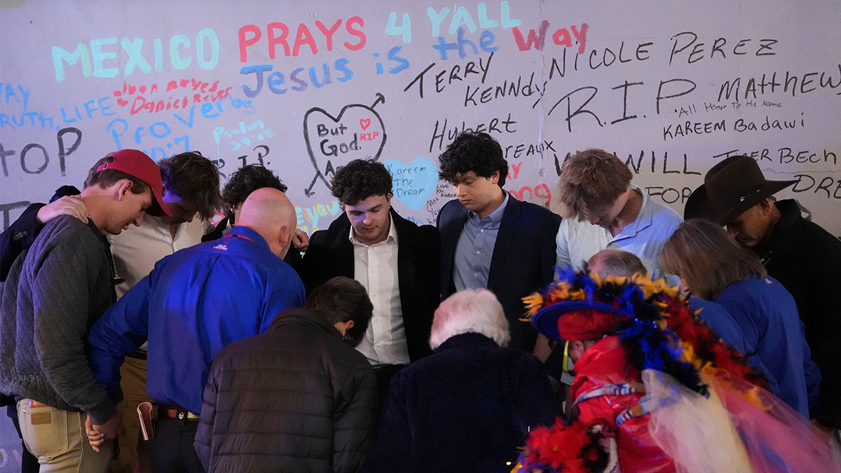 Friends of Kareem Badawi, a victim of the deadly truck attack on New Year's Day in New Orleans, pray at a memorial for victims